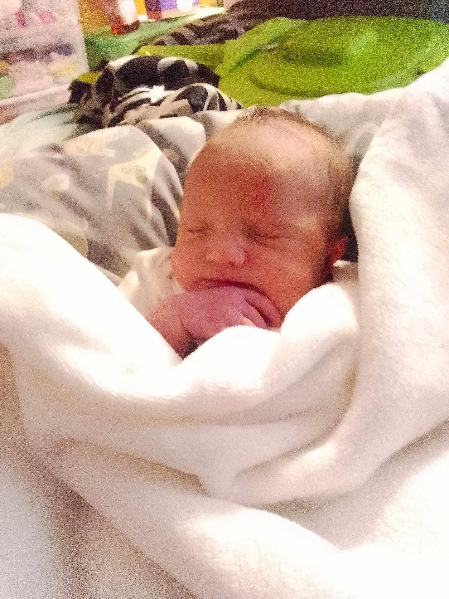Stormi Dallas is registered to the contest to win money with this photo: baby, newborn, sleeping, blanket, white_blanket, infant, cozy, bed, soft, wrapped, hand, peaceful, indoors, person, closeup, cute, resting, toddler, nursery, warm