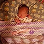 Stormi Dallas is registered to the contest to win money with this photo: baby, newborn, sleeping, crib, blanket, bedding, animal_print, lion, elephant, giraffe, pattern, bedroom, infant, child, cute, soft_lighting, peaceful, indoors, sleep, rest