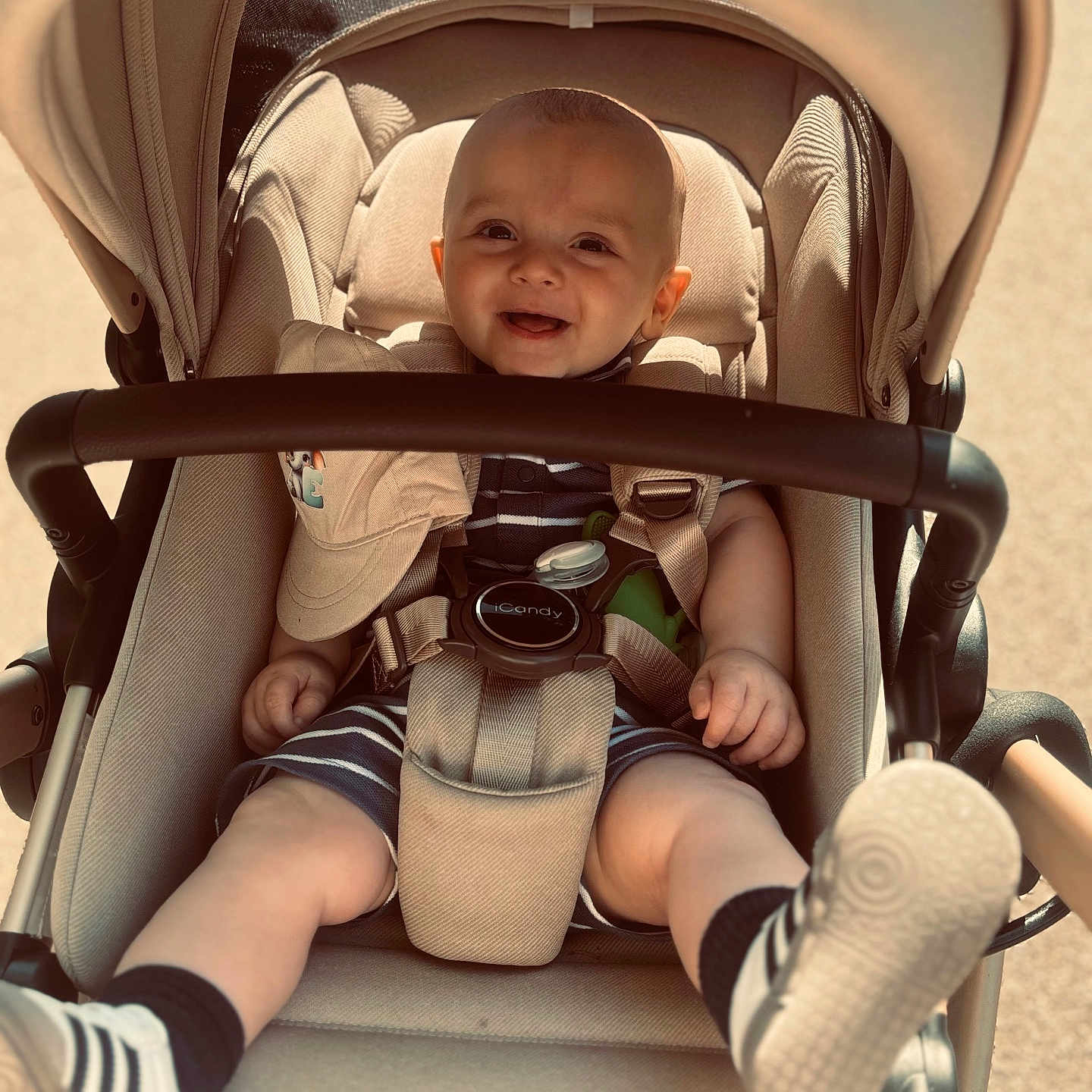 Evan joined the competition — help win amazing prizes! baby, city, clothing, face, footwear, glove, hat, head, hosiery, outdoors, person, photography, portrait, road, shoe, shorts, sock, street, stroller, urban