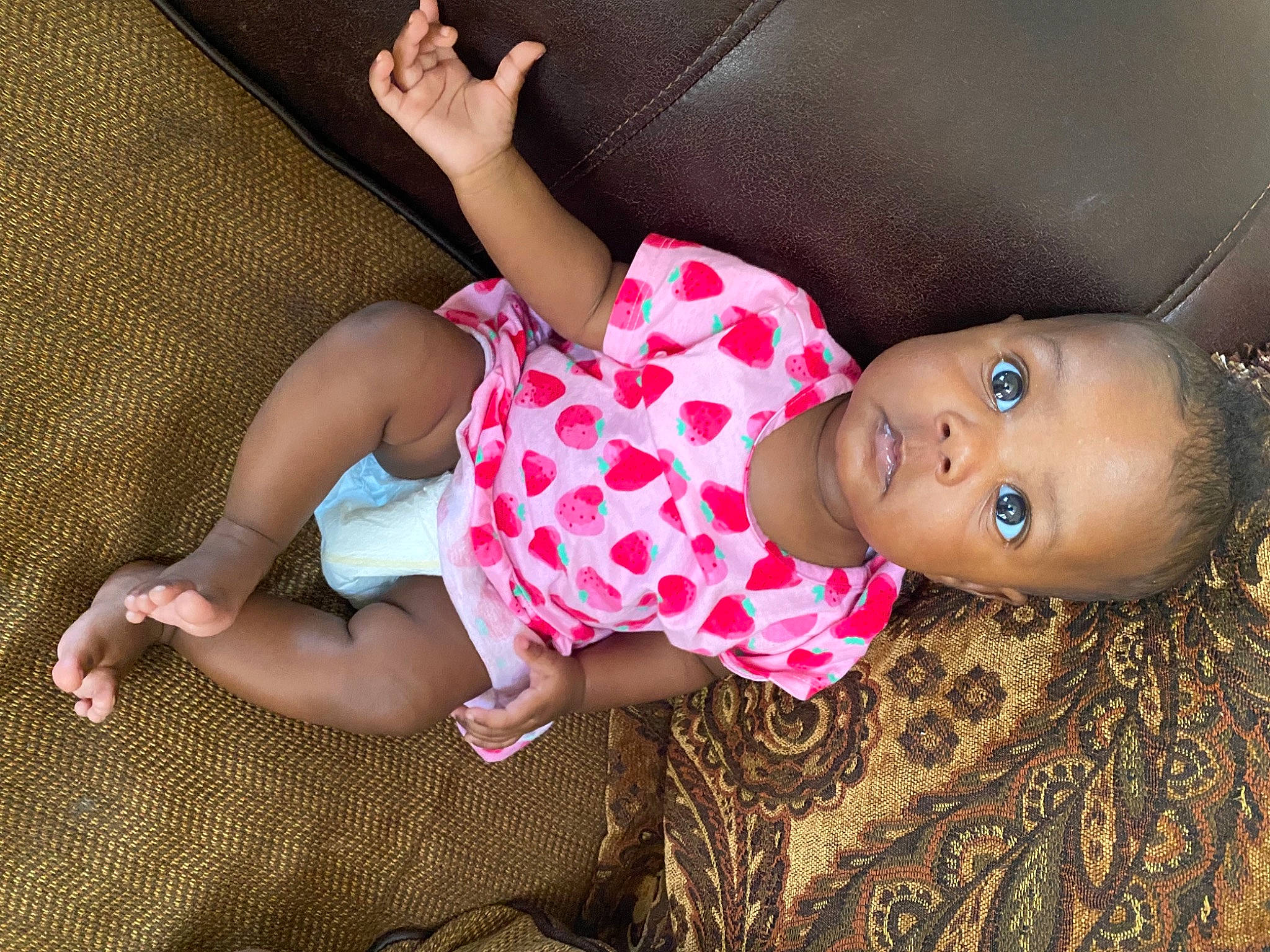 Ailani is registered to the contest to win money with this photo: baby_toddler_clothing, child, comfort, doll, fun, hat, human_leg, joint, leg, mouth, nail, pattern, person, pink, skin, sunglasses, textile, thigh, toddler, toy