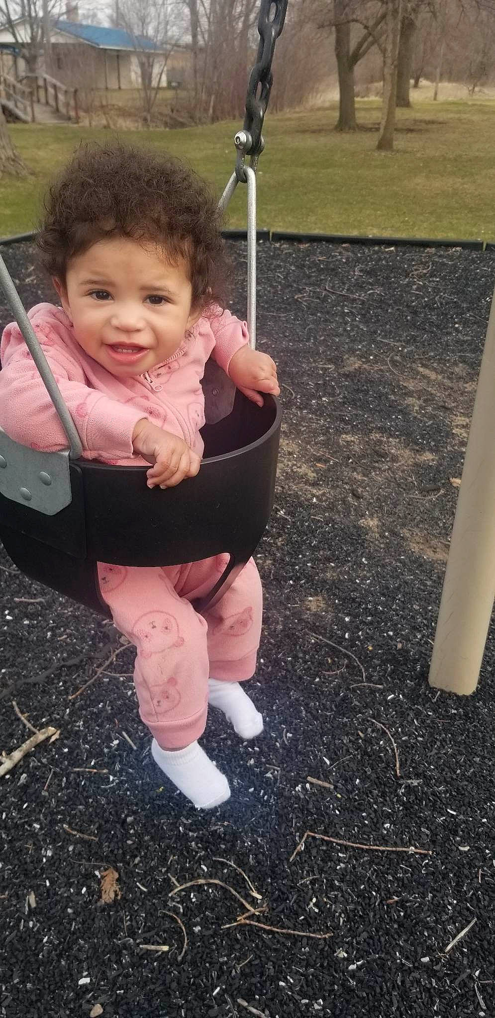 Laycee joined the competition — help win amazing prizes! baby, baby_toddler_clothing, cheek, child, city, face, fun, grass, happy, human_leg, leisure, outdoor_play_equipment, person, pink, play, playground, recreation, sitting, smile, swing