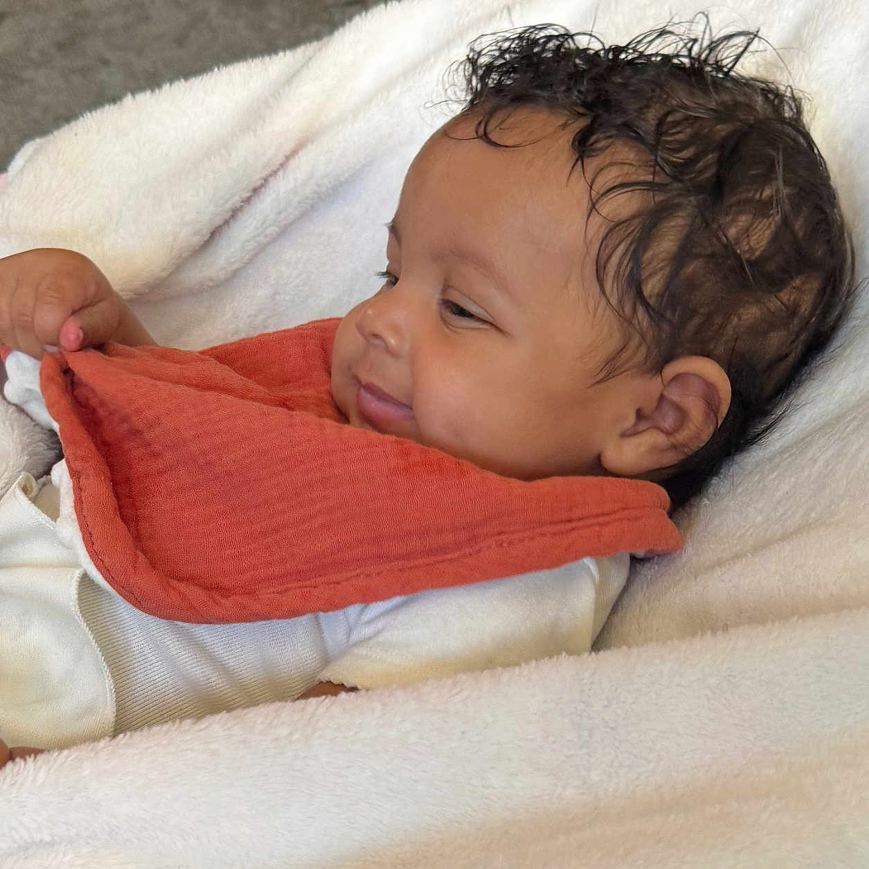 Geonna joined the competition — help win amazing prizes! baby, bib, blanket, child, clothing, comfort, cute, face, hand, happy, head, indoors, infant, lying_down, portrait, resting, skin, smile, soft_texture, young