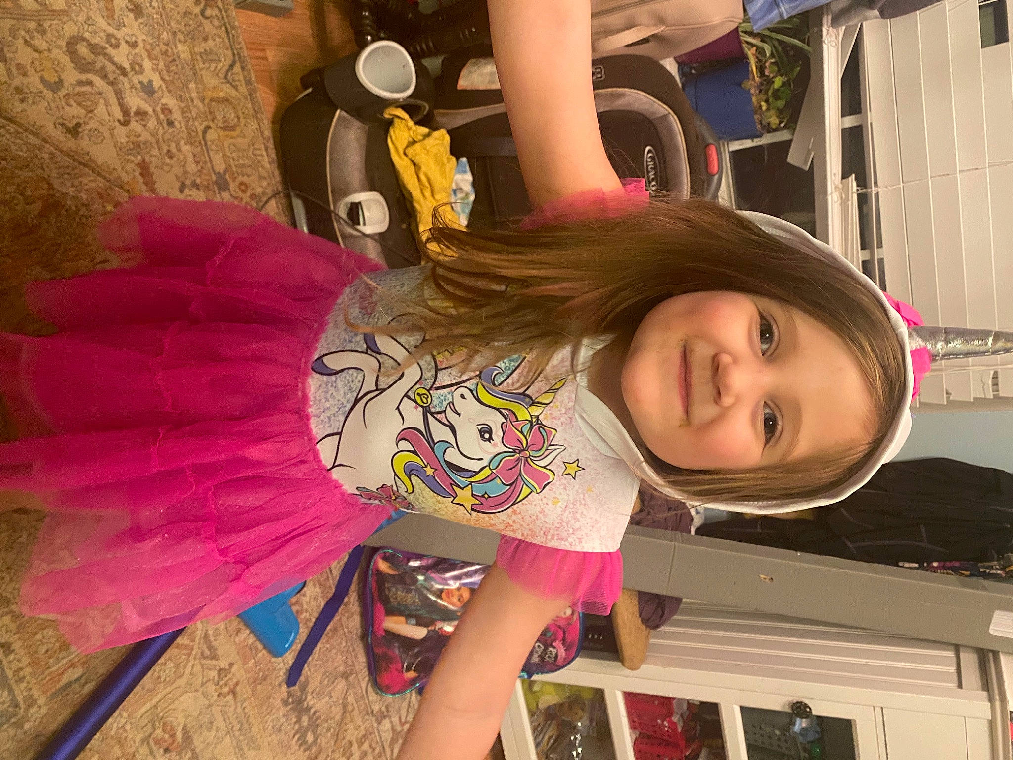 Rosalee is registered to the contest to win money with this photo: bangs, child, facial_expression, fashion_accessory, fun, hair_coloring, hairstyle, happy, hime_cut, human_leg, joy, magenta, pattern, person, pink, smile, street_fashion, thigh, tire, toddler
