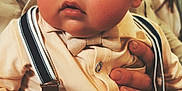 Jonas participe au concours pour gagner de l'argent avec cette photo : baby, bow_tie, candid, child, closeup, clothing, cute, expression, face, fashion, focus, hand, hat, indoor, person, portrait, support, suspenders, warm_lighting, young_child