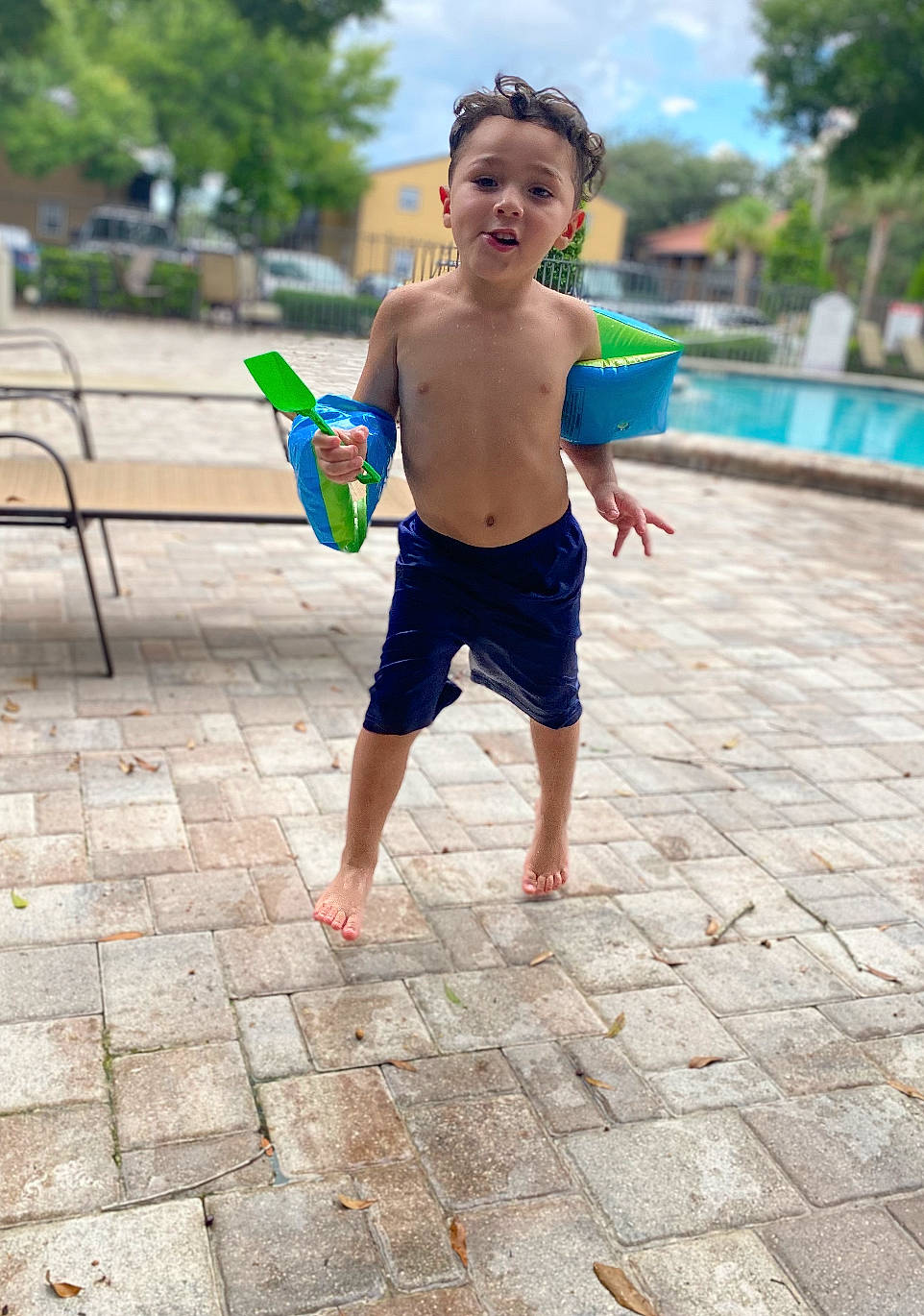 Isaiah joined the competition — help win amazing prizes! barechested, barefoot, child, city, cloud, face, flooring, fun, happy, leisure, person, play, recreation, shorts, sky, summer, swimming_pool, toddler, tree, vacation