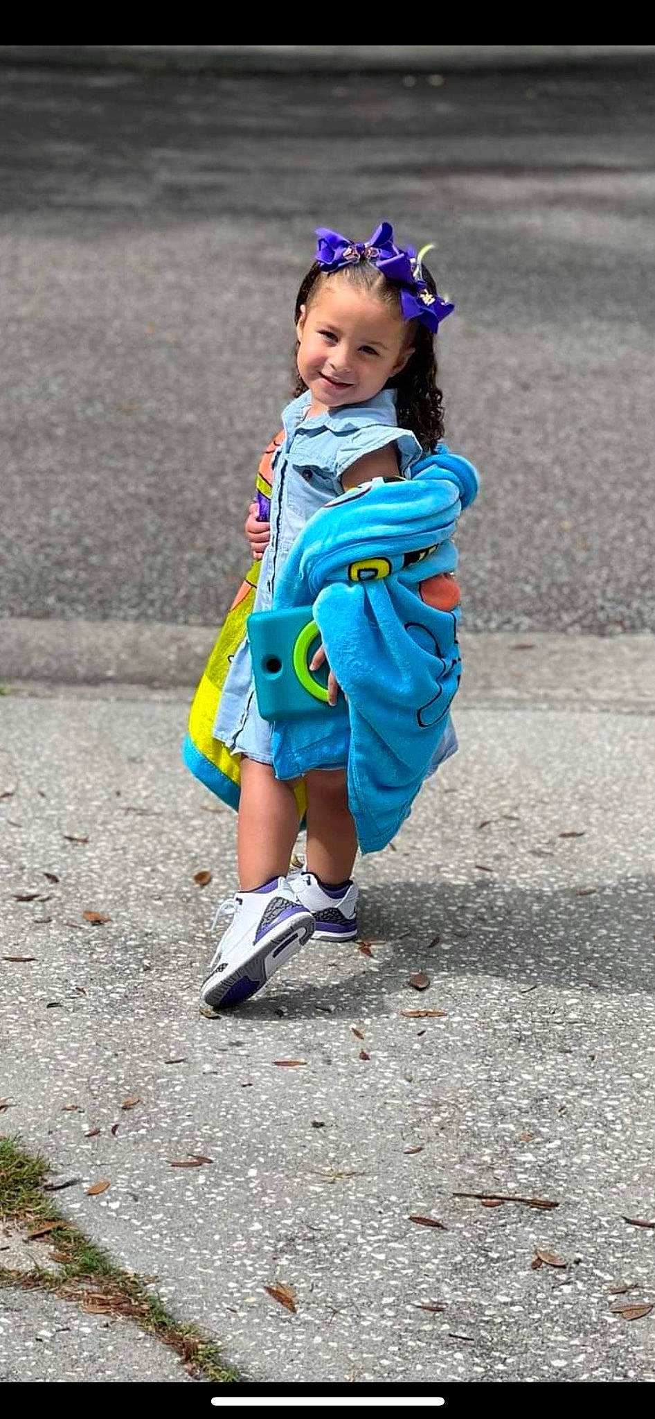 Serenity is registered to the contest to win money with this photo: asphalt, child, child_model, costume, electric_blue, fun, happy, joy, leisure, person, photo_shoot, recreation, road, sandal, smile, soil, street, toddler, vacation, walking