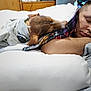 man, dog, sleeping, bed, blanket, cozy, resting, indoor, furniture, pillow, wooden, casual, plaid_shirt, pet, relaxation, comfort, home, face, arm, snuggling
