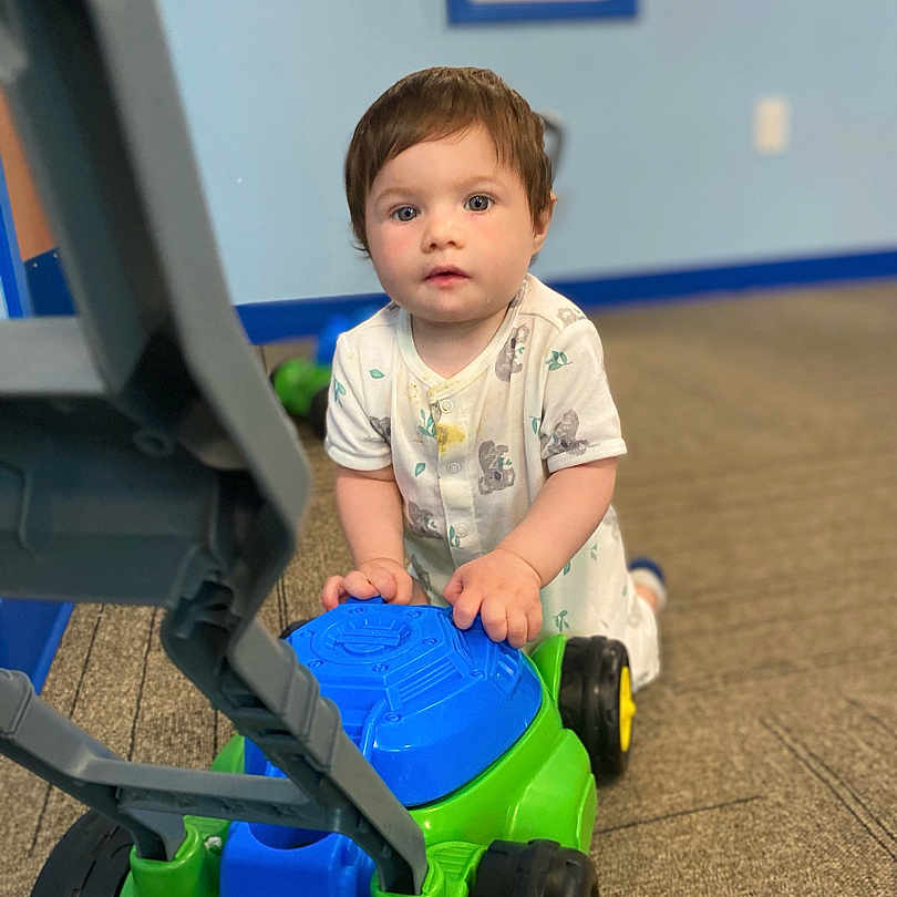 Thomas is registered to the contest to win money with this photo: boy, car, child, clothing, face, footwear, grass, head, indoors, lawn, machine, male, person, photography, plant, portrait, shoe, transportation, vehicle, wheel