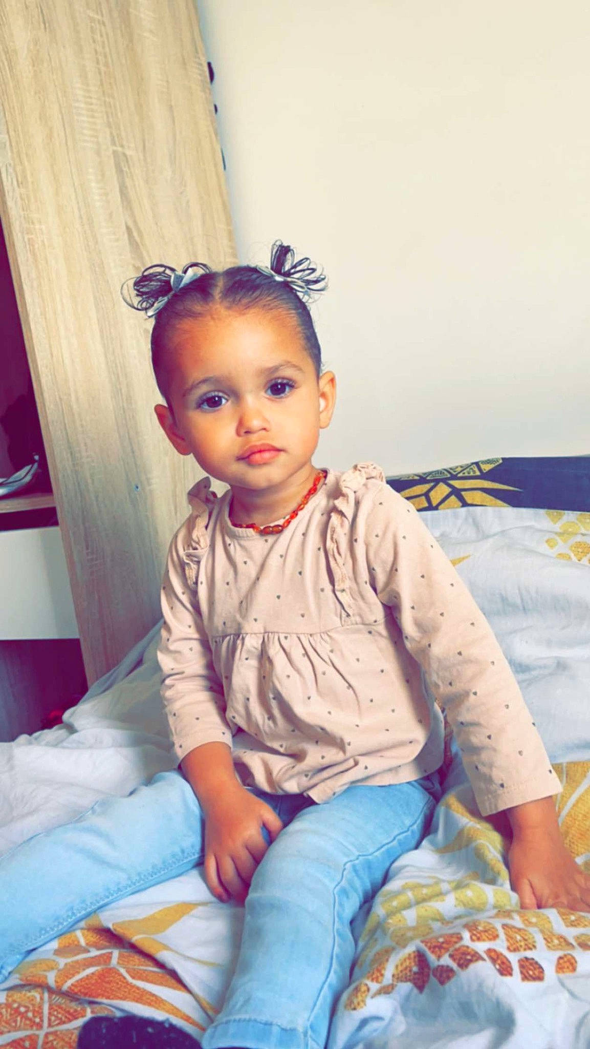 Alyah participe au concours pour gagner de l'argent avec cette photo : baby_toddler_clothing, cheek, child, comfort, denim, door, eye, fashion_design, flash_photography, fun, happy, headband, jeans, lap, pattern, person, room, sitting, sleeve, t_shirt