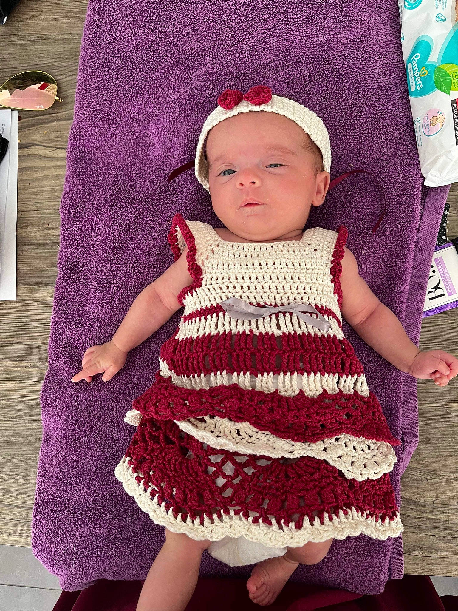 Elyna participe au concours pour gagner de l'argent avec cette photo : baby, baby_toddler_clothing, cap, cheek, child, day_dress, dress, headgear, magenta, one_piece_garment, pattern, person, pink, product, purple, sleeve, textile, toddler, violet, white