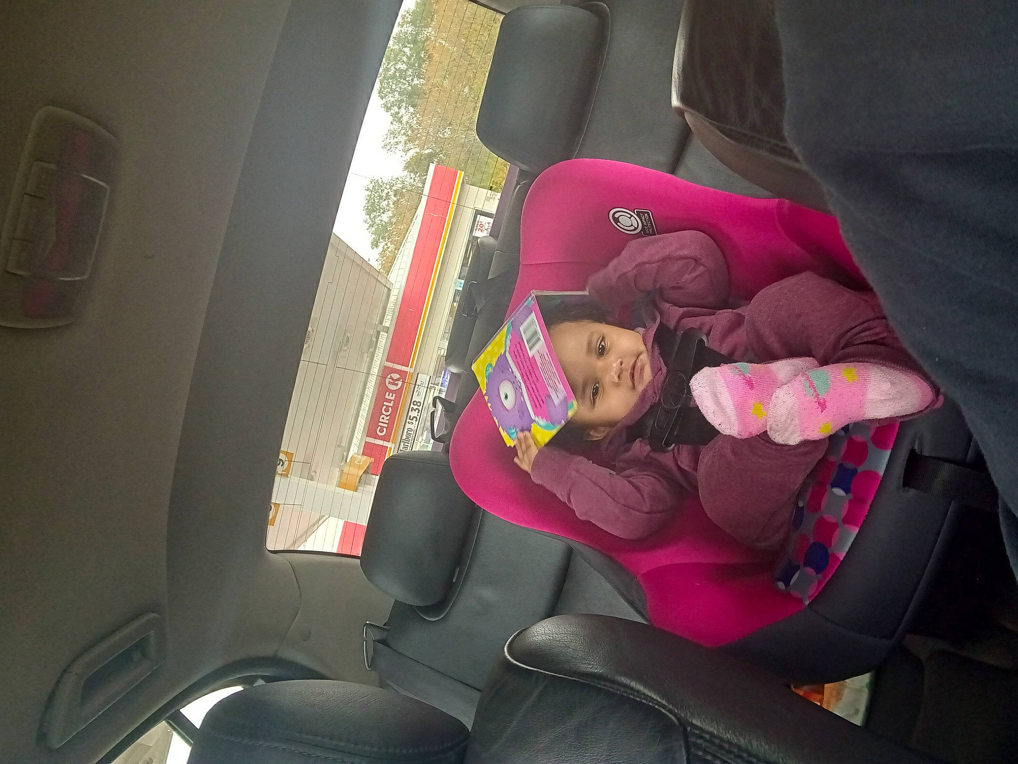 Anastacia is registered to the contest to win money with this photo: auto_part, automotive_design, automotive_exterior, car, car_seat, car_seat_cover, comfort, family_car, finger, head_restraint, headwear, human_leg, leg, luxury_vehicle, magenta, motor_vehicle, person, plant, thigh, vehicle