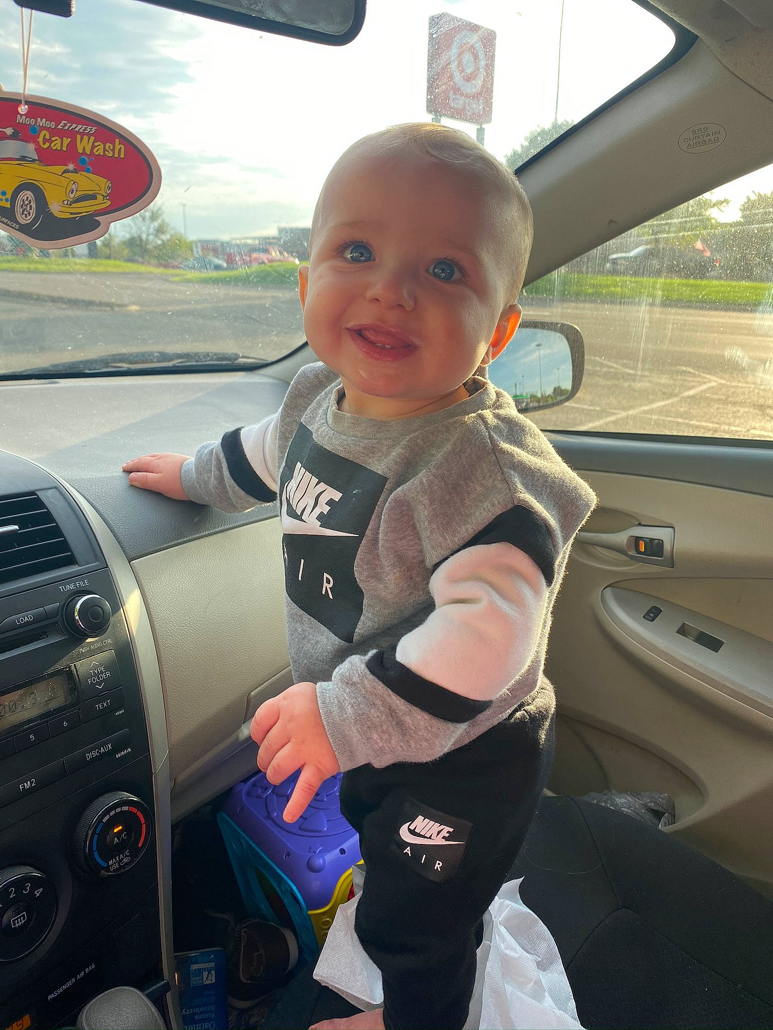 Jamison is registered to the contest to win money with this photo: auto_part, automotive_window_part, car, car_seat, child, driving, family_car, person, toddler, vehicle, vehicle_door, windshield