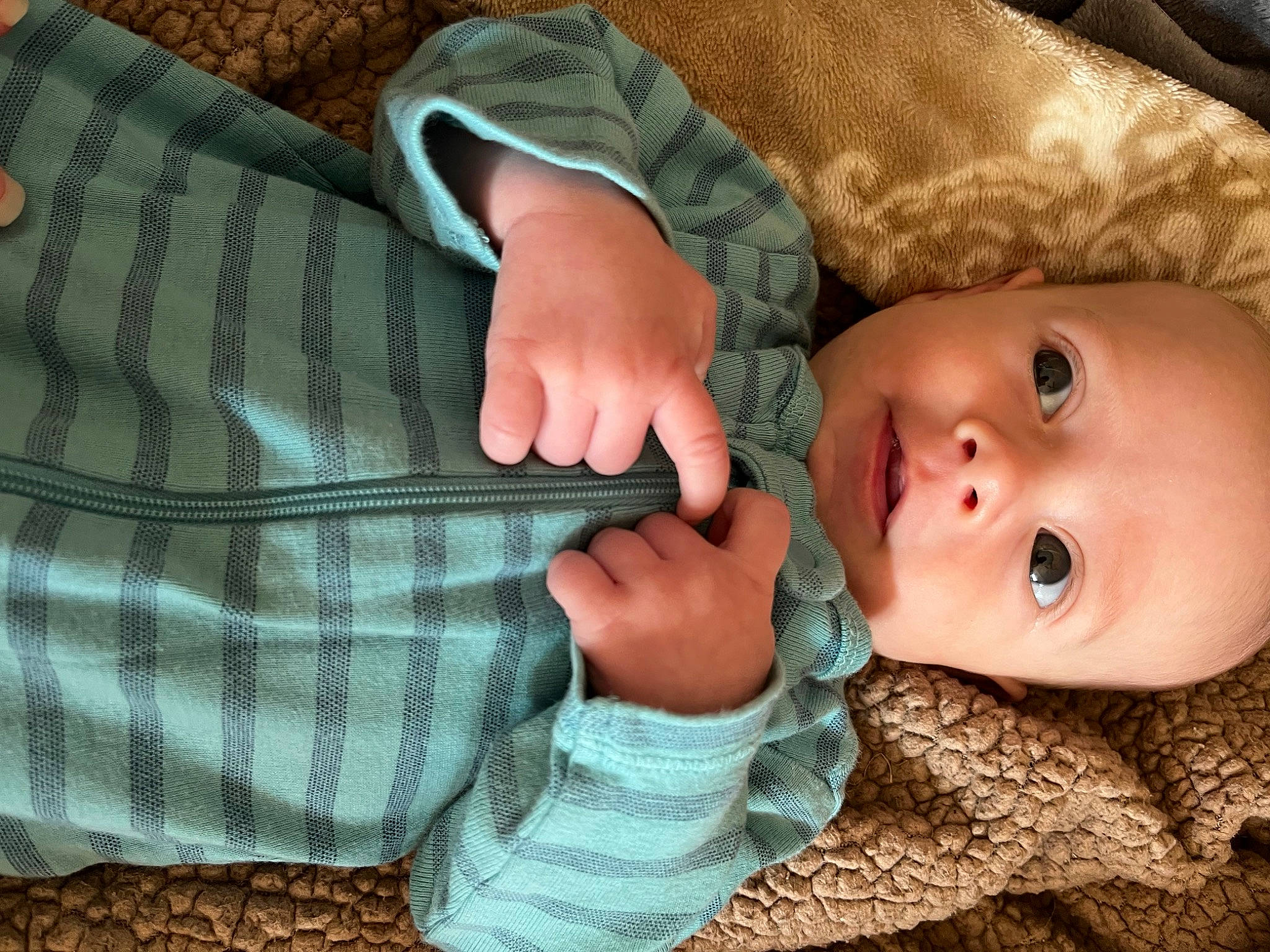 Emerson joined the competition — help win amazing prizes! baby, baby_toddler_clothing, cheek, comfort, eye, eyelash, finger, gesture, hand, nail, nose, pattern, person, plaid, skin, sleeve, tartan, textile, thumb, toddler