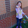 Elizabeth joined the competition — help win amazing prizes! architecture, bag, brick, building, child, clothing, face, female, footwear, girl, grass, head, outdoors, pants, person, photography, plant, portrait, shelter, shoe