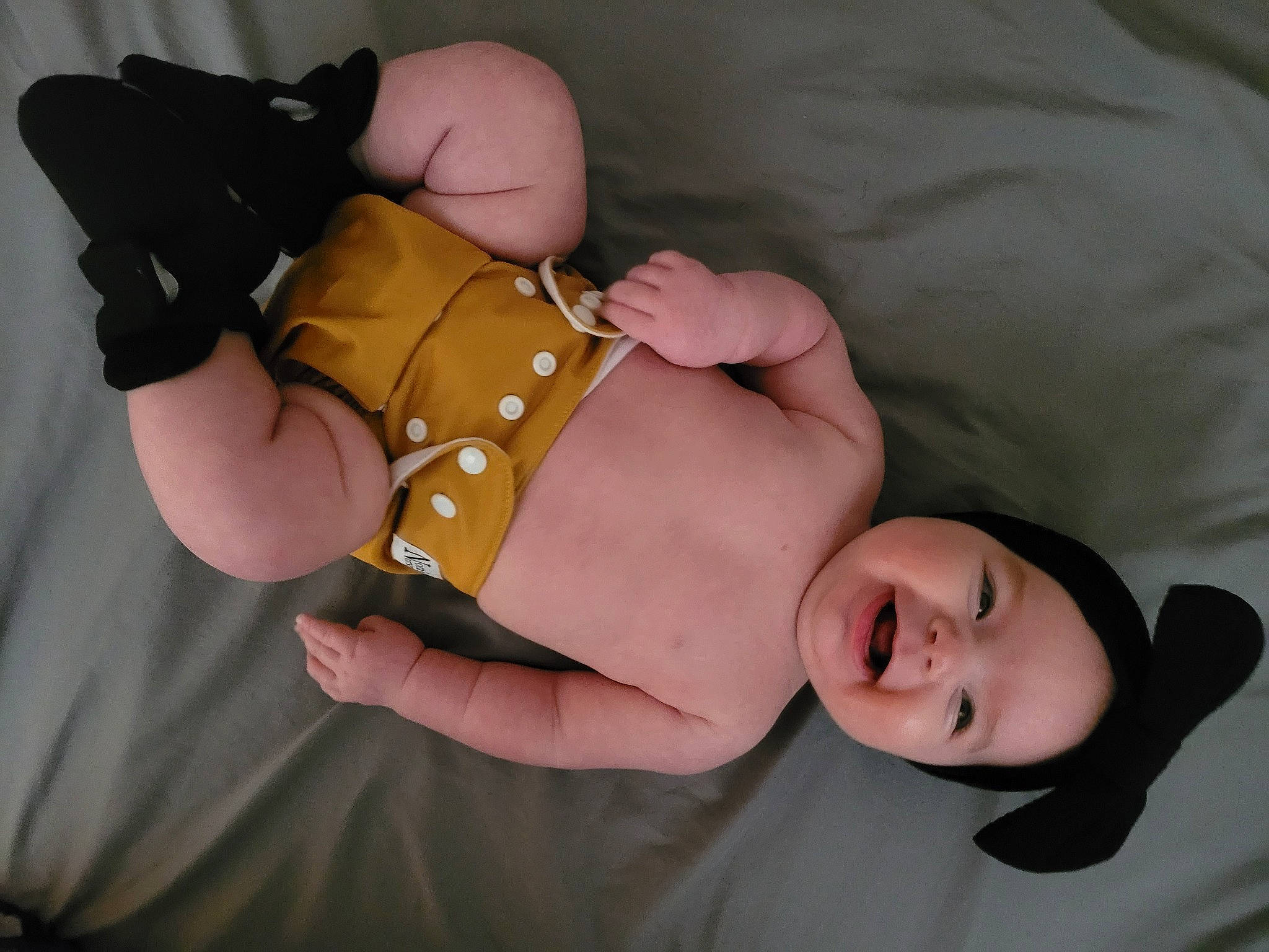 Jesse is registered to the contest to win money with this photo: abdomen, baby, baby_toddler_clothing, chest, child, comfort, finger, gesture, glasses, hand, headgear, headwear, human_body, leg, person, skin, smile, stomach, thigh, toddler