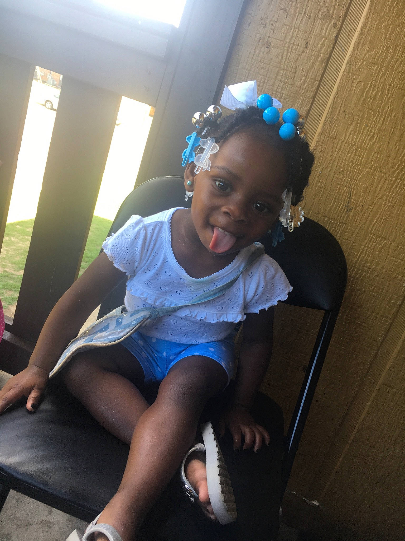 Mariyah joined the competition — help win amazing prizes! black_hair, blue, child, cool, ear, fashion_accessory, fun, hair_accessory, happy, headgear, joy, leg, person, photography, shoe, sitting, skin, smile, toddler, vacation