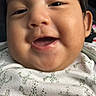 baby, child, close_up, clothing, cute, expression, eyes, face, happy, head, indoors, infant, joy, mouth, patterned_clothing, person, portrait, skin, smiling, young