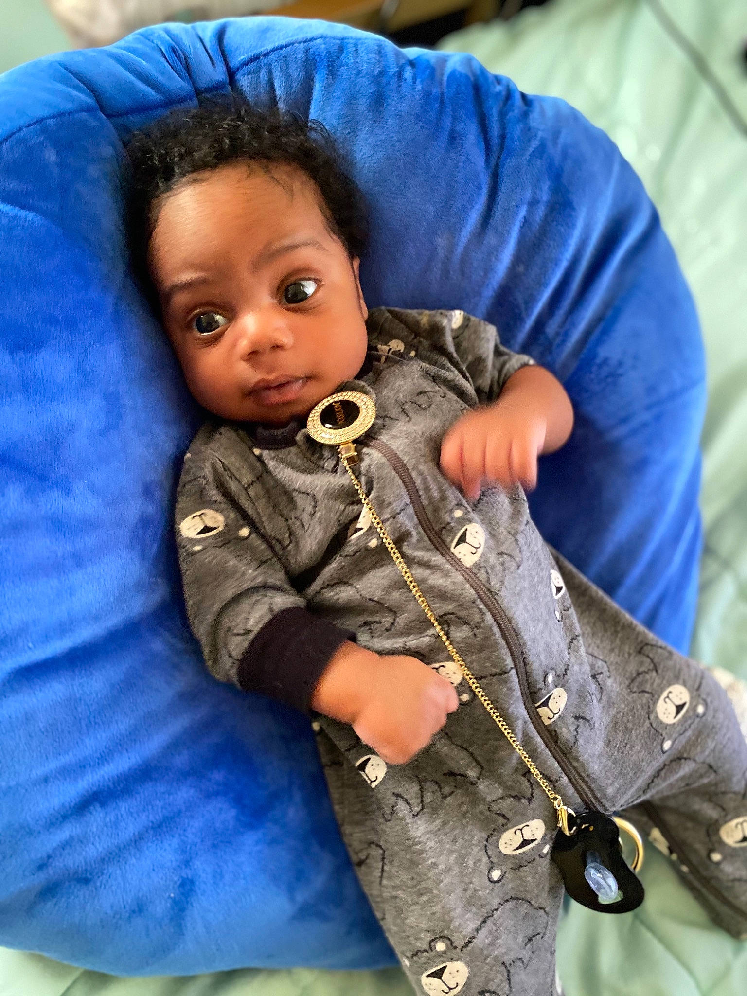 Amari is registered to the contest to win money with this photo: arm, baby, child, cool, denim, electric_blue, face, gesture, hand, happy, human_body, jacket, military_camouflage, military_person, military_uniform, non_commissioned_officer, outerwear, person, skin, sleeve
