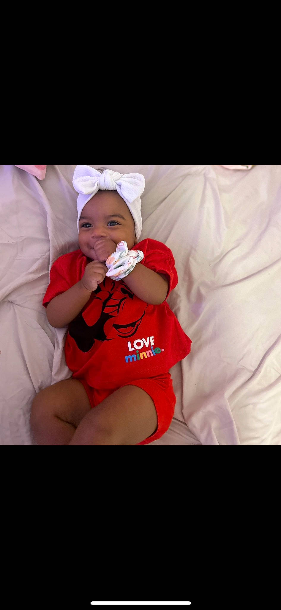 Miyla is registered to the contest to win money with this photo: abdomen, baby, baby_toddler_clothing, carmine, child, comfort, elbow, flash_photography, happy, hat, headwear, human_leg, knee, magenta, nail, person, pink, sleeve, t_shirt, thigh