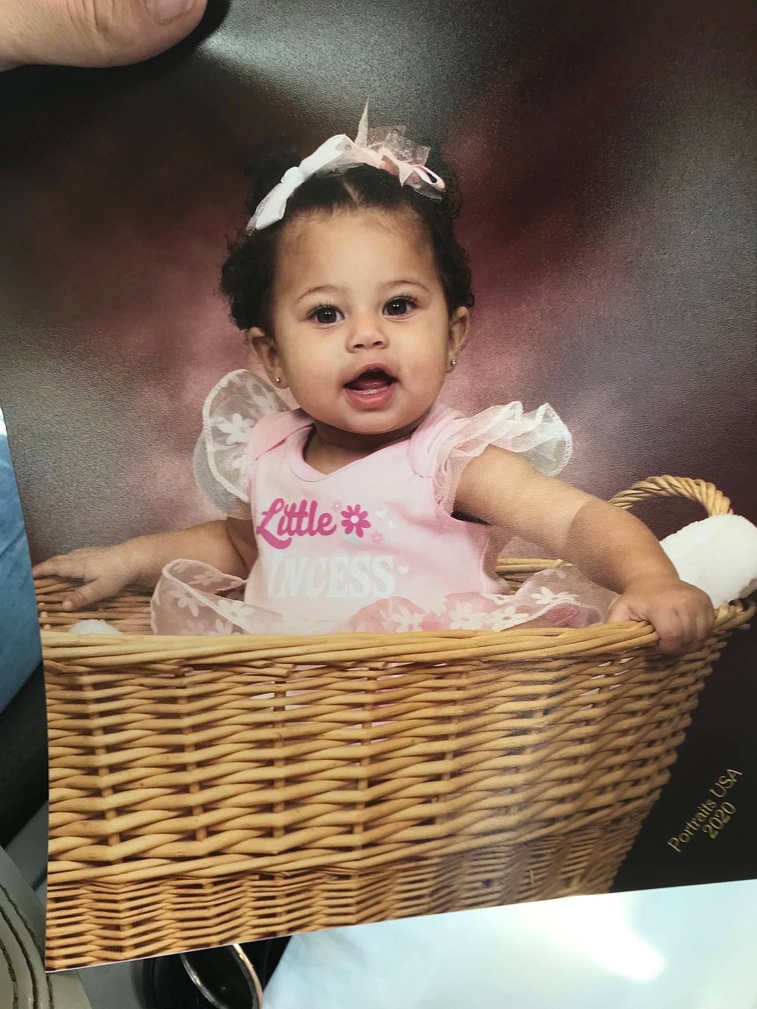 Amiya is registered to the contest to win money with this photo: baby, baby_products, baby_toddler_clothing, basket, bicycle_accessory, child, embellishment, gesture, hair_accessory, headband, headpiece, home_accessories, person, picnic_basket, product, storage_basket, toddler, wicker