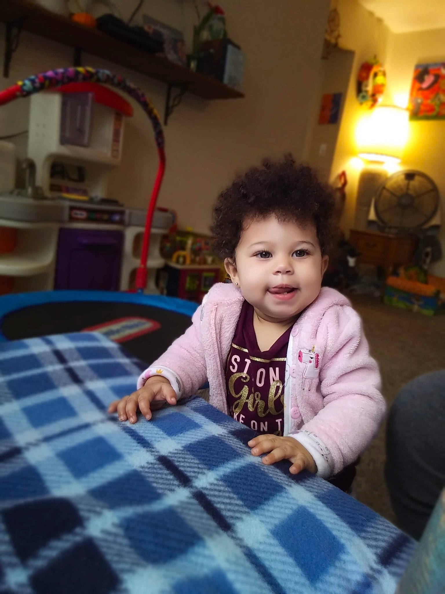 Amiya is registered to the contest to win money with this photo: baby, baby_toddler_clothing, baby_toys, beer, child, drink, home, home_accessories, houseplant, linens, living_room, pattern, person, picture_frame, plaid, play, room, tablecloth, tartan, textile