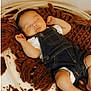 baby, infant, sleeping, newborn, overalls, denim, blanket, knitted_blanket, basket, cozy, nap, peaceful, portrait, soft_texture, cute, hands, legs, indoor, brown, photography