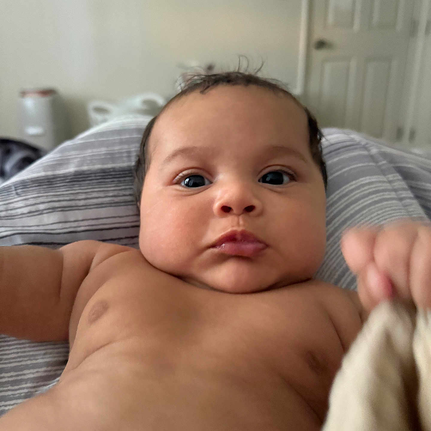 Leimana joined the competition — help win amazing prizes! arm, baby, blanket, child, closeup, cloth, curious, door, expression, face, hand, indoor, infant, pale, portrait, room, skin, soft, striped, young