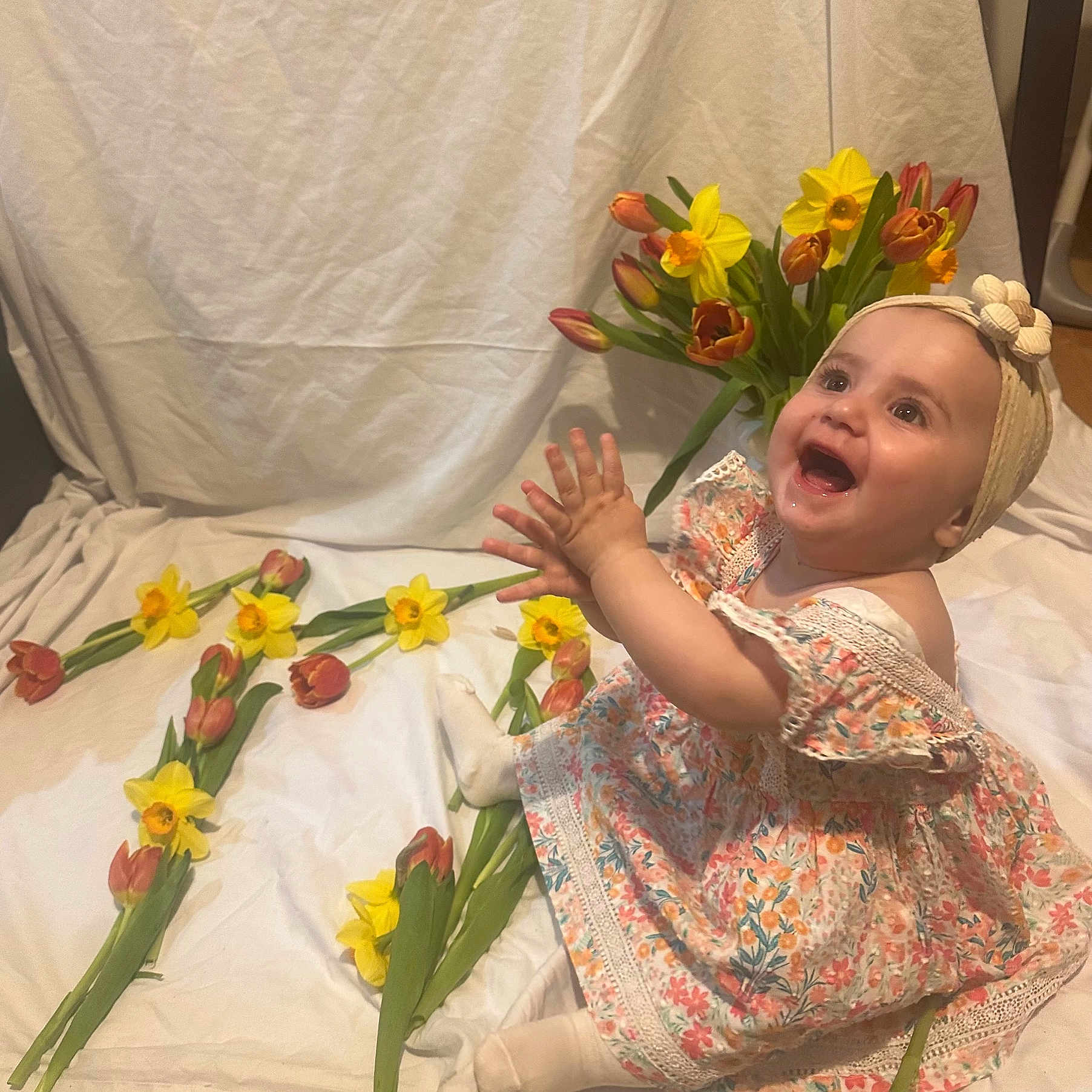 Orly is registered to the contest to win money with this photo: baby, babylaughing, clothing, crying, daisy, face, flower, flowerarrangement, flowerbouquet, happy, head, person, petal, photography, plant, portrait, sad, sitting, sleeve, yawning