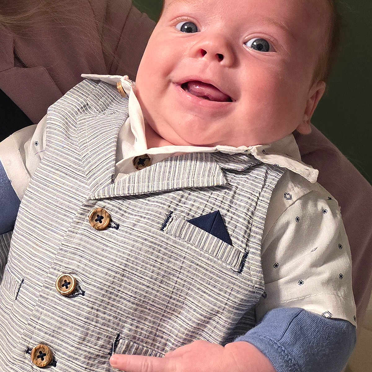 Levi is registered to the contest to win money with this photo: baby, bodypart, clothing, coat, face, finger, hand, happy, head, jacket, knitwear, machine, pants, person, photography, portrait, screw, shirt, smile, sweater