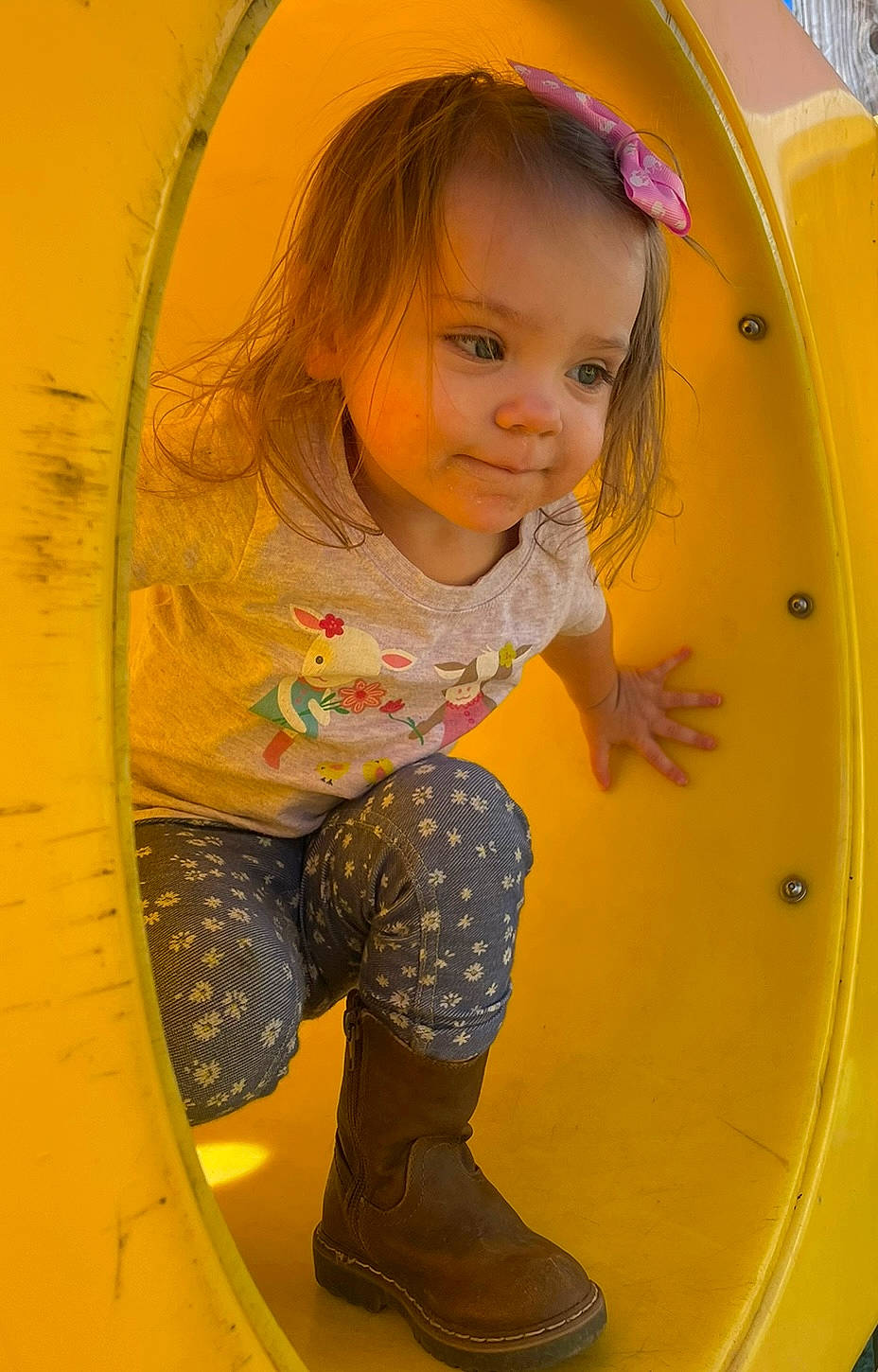 Evie is registered to the contest to win money with this photo: baby_toddler_clothing, blond, child, circle, city, electric_blue, fun, hair, happy, human_leg, leisure, organ, outdoor_play_equipment, person, play, playground, recreation, t_shirt, thigh, toddler