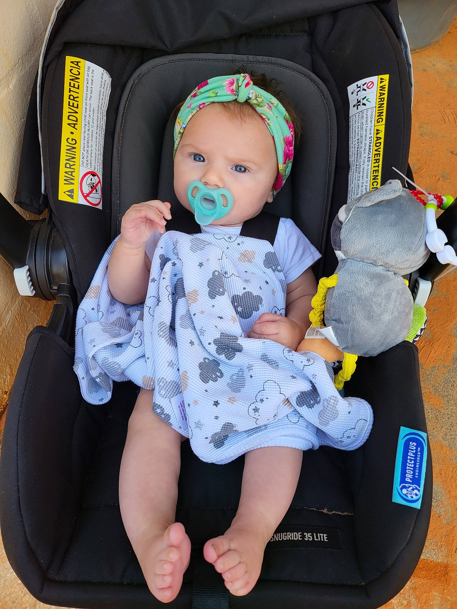Aubrey is registered to the contest to win money with this photo: baby, baby_carriage, baby_products, baby_safety, baby_toddler_clothing, bag, car_seat, chair, child, comfort, doll, headgear, lap, luggage_and_bags, pattern, person, product, stuffed_toy, toddler, toy