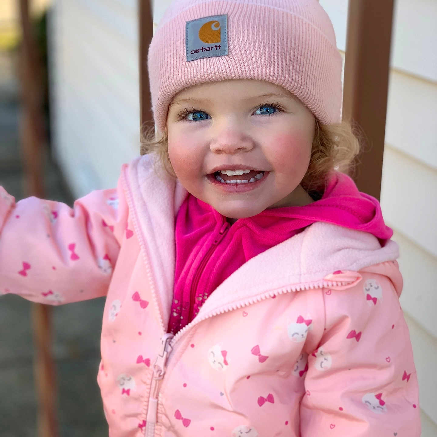 Scarlett joined the competition — help win amazing prizes! baby, beanie, bonnet, cap, clothing, coat, face, glove, happy, hat, head, hood, jacket, knitwear, person, photography, portrait, purple, smile, sweater