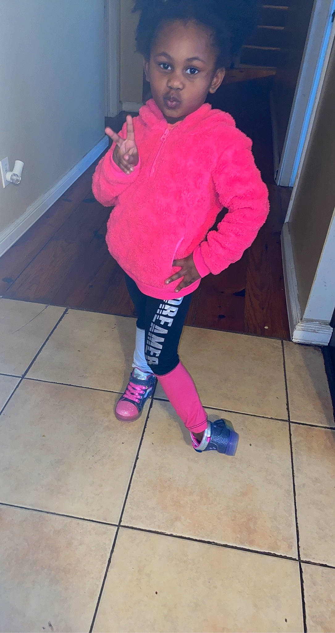 Cori is registered to the contest to win money with this photo: baby_toddler_clothing, carmine, electric_blue, floor, flooring, hat, human_leg, knee, leg, magenta, pattern, person, pink, purple, shoe, sleeve, sneakers, sock, sportswear, thigh