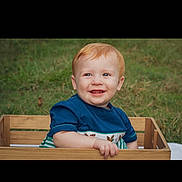 Bowen joined the competition — help win amazing prizes! baby, blue_shirt, casual_clothing, child, cute, daylight, grass, happy, innocence, nature, outdoor, person, playful, portrait, red_hair, sitting, smiling, toddler, wooden_crate, young_child
