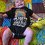 Derek joined the competition — help win amazing prizes! applique, baby, bed, clothing, couch, cushion, diaper, face, furniture, head, homedecor, pants, pattern, person, photography, portrait, quilt, shorts, sitting, t_shirt