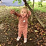 Myla joined the competition — help win amazing prizes! toddler, child, outdoor, tree, leaves, pink_clothing, reaching, nature, ground, grass, playground, person, young_child, autumn, shoes, cute, casual_clothing, daylight, happy, curly_hair