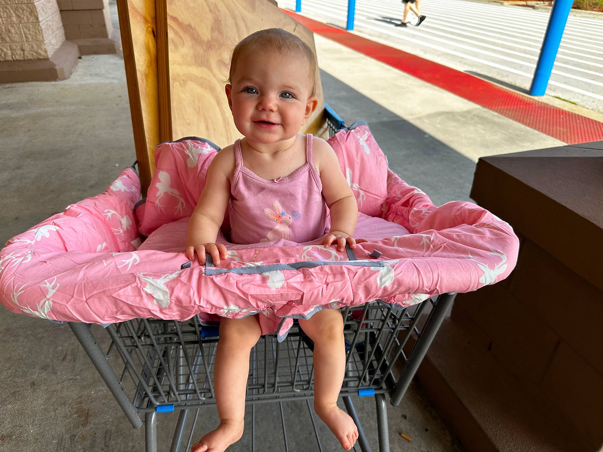 Alayna is registered to the contest to win money with this photo: baby, baby_toddler_clothing, barefoot, child, foot, fun, happy, human_leg, joy, lap, leisure, magenta, person, pink, red, sitting, skin, smile, thigh, toddler