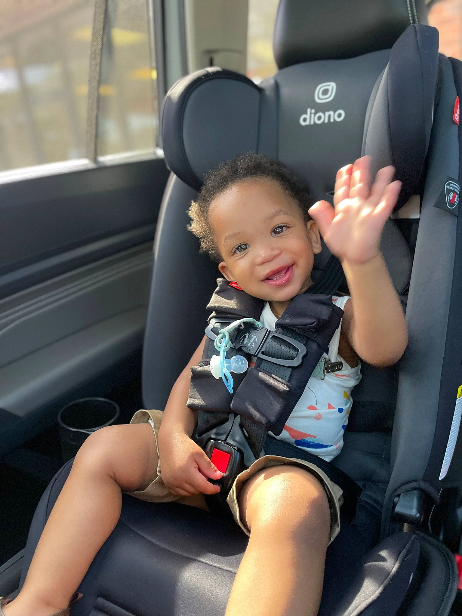 Cree is registered to the contest to win money with this photo: arm, auto_part, automotive_design, baby, car, car_seat, car_seat_cover, comfort, head_restraint, joy, motor_vehicle, person, seat_belt, smile, steering_part, steering_wheel, thigh, toddler, travel, vehicle