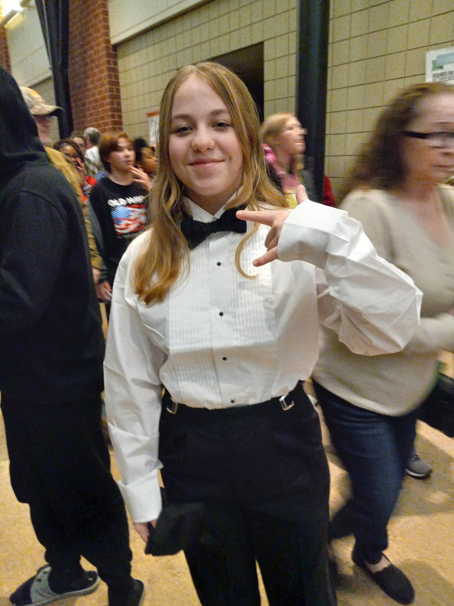 Christine is registered to the contest to win money with this photo: belt, brown_hair, community, event, eyewear, fashion_design, formal_wear, fun, fur, hair_coloring, hairstyle, handbag, human, joy, layered_hair, long_hair, luggage_and_bags, person, smile, tourism