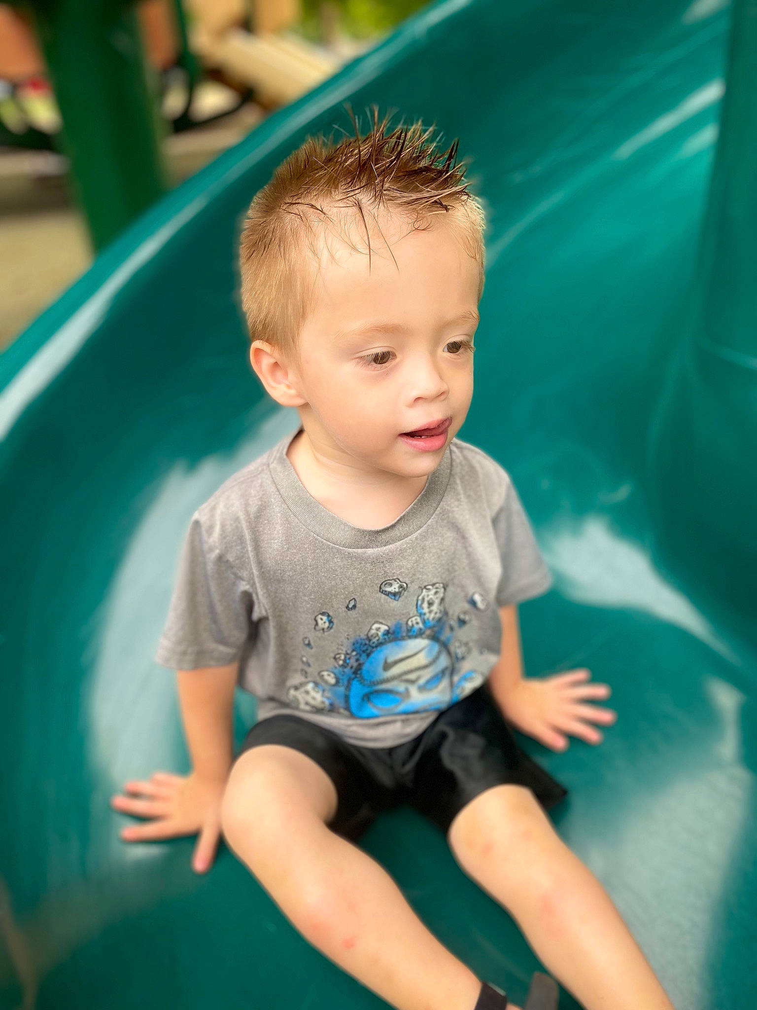 Lucas is registered to the contest to win money with this photo: azure, baby, baby_toddler_clothing, bathing, blue, child, electric_blue, fun, grass, green, happy, leisure, person, play, recreation, shorts, sitting, t_shirt, toddler, vacation