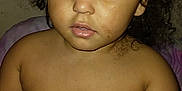 Dalilah is registered to the contest to win money with this photo: child, toddler, diaper, curly_hair, brown_eyes, skin, face, bare_chest, expressionless, indoor, portrait, person, young_child, baby, cute, curly, looking, seated, skin_tone, childhood