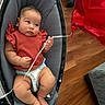 Evangeline is registered to the contest to win money with this photo: baby, infant, diaper, red_balloon, baby_rocker, gray_fabric, curious, chubby_arms, indoor, flooring, wood_floor, casual_clothing, orange_shirt, string, footwearless, cute, child, person, home, relaxing