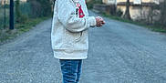 Alexis a rejoint le concours — aidez-le/la à gagner de superbes lots ! child, boy, smiling, standing, road, jeans, jacket, outdoor, mountains, trees, shoes, casual_clothing, daylight, nature, happy, person, scenic, background, side_view, portrait