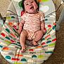 Braelyne joined the competition — help win amazing prizes! baby, infant, smiling, baby_swing, colorful, patterned, carpet, indoor, clothing, onesie, happy, person, child, furniture, seat, toy, play, cute, hair, expression