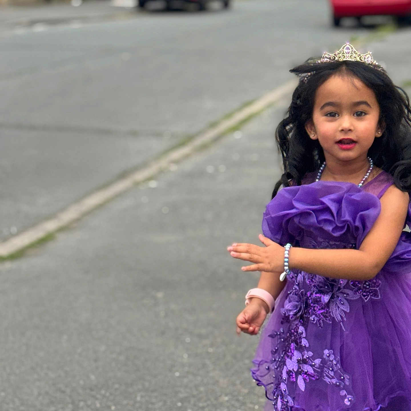 Bryannah joined the competition — help win amazing prizes! accessories, bracelet, cars, child, curly_hair, cute, fashion, girl, happy, outdoor, person, portrait, purple_dress, sidewalk, smile, street, suburban, tiara, walking, young
