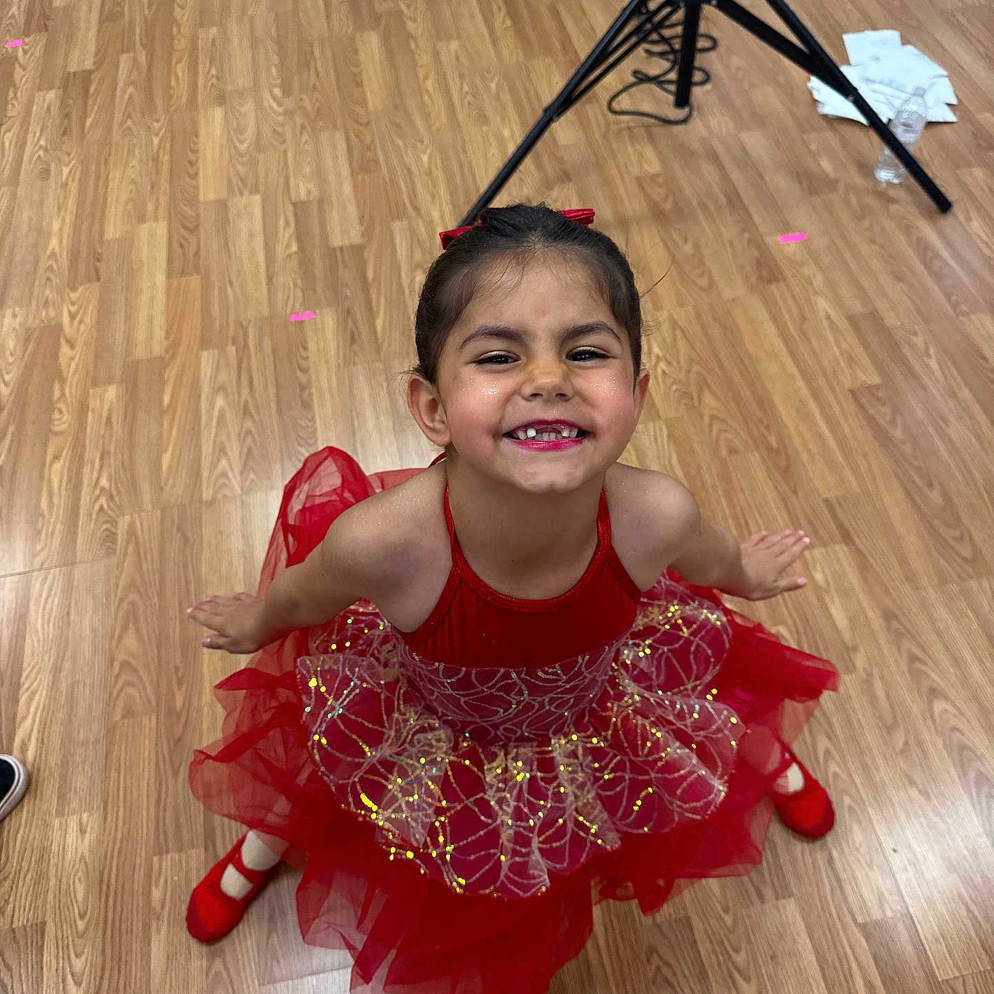 Abigail is registered to the contest to win money with this photo: child, clothing, dancing, dress, eveningdress, face, female, footwear, formalwear, girl, hardwood, head, indoors, leisureactivities, person, photography, portrait, shoe, tripod, wood