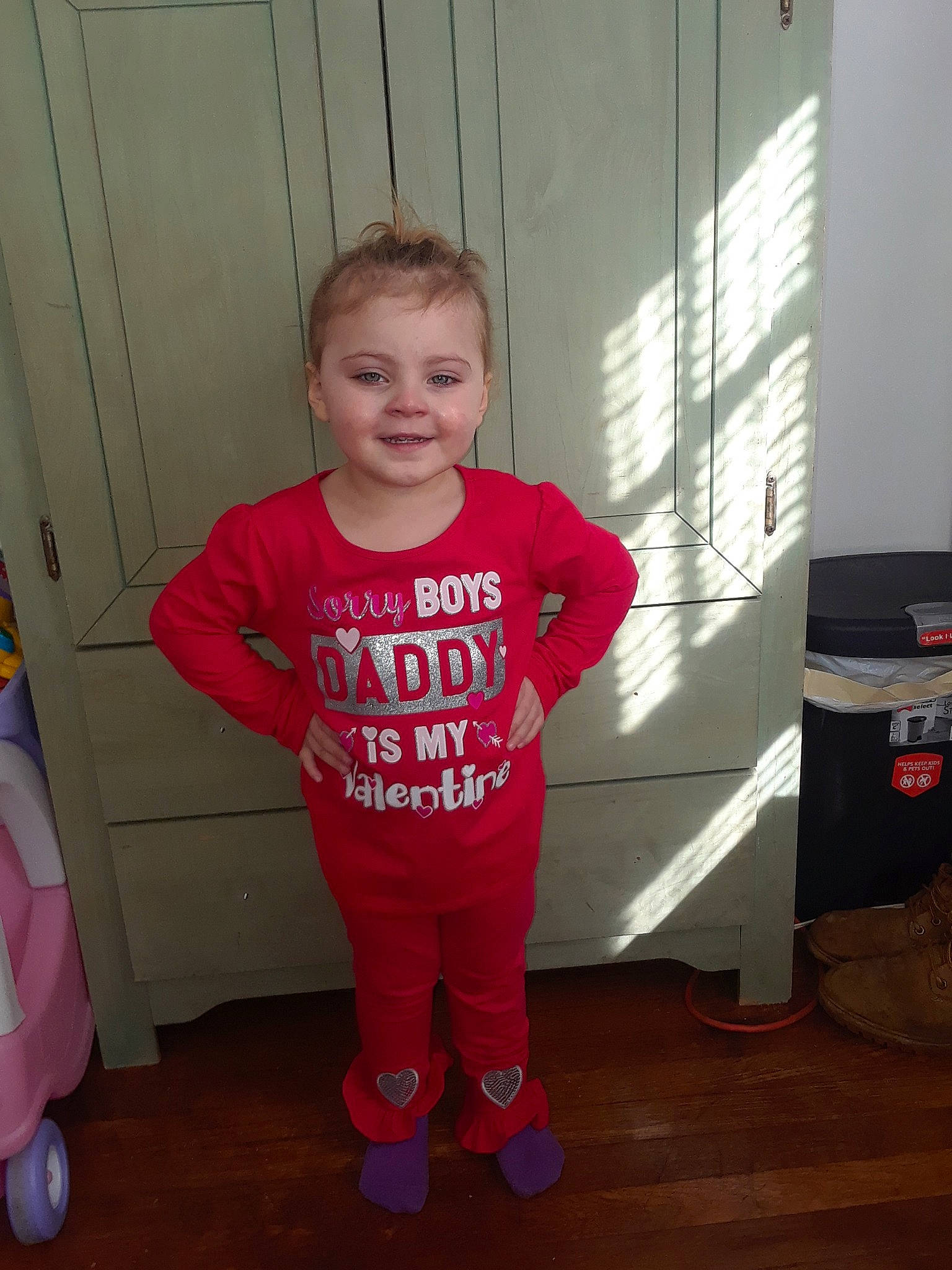 Chloe is registered to the contest to win money with this photo: child, joy, outerwear, pajamas, person, sleeve, smile, standing, t_shirt, toddler