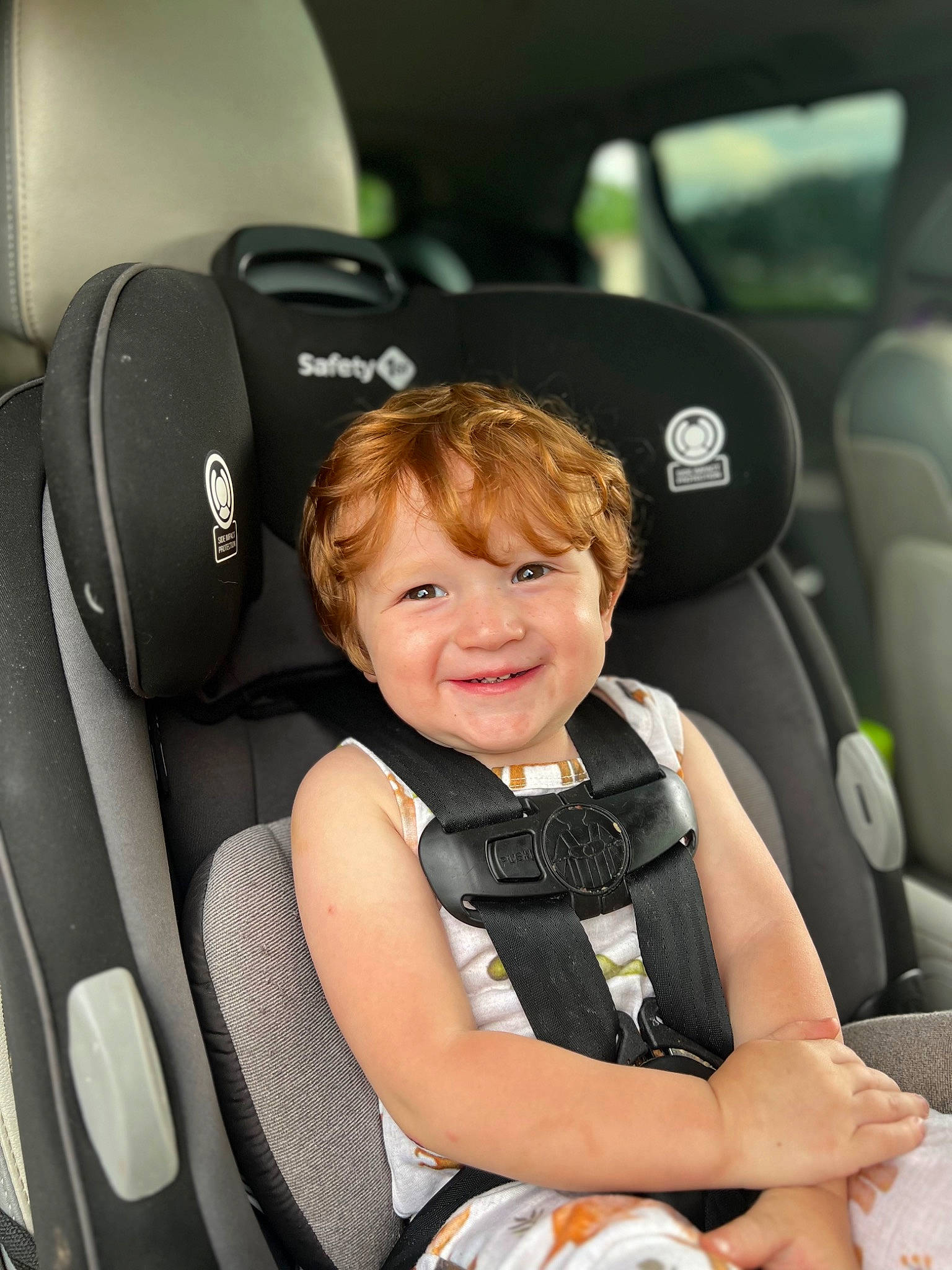 Gabe is registered to the contest to win money with this photo: auto_part, automotive_design, baby, car, car_seat, car_seat_cover, comfort, family_car, flash_photography, head_restraint, joy, luxury_vehicle, motor_vehicle, person, personal_luxury_car, product, smile, steering_wheel, toddler, vehicle