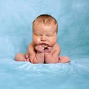 Adyn is registered to the contest to win money with this photo: baby, babylaughing, biting, bodypart, face, finger, hand, happy, head, laughing, newborn, person, photography, portrait, smile