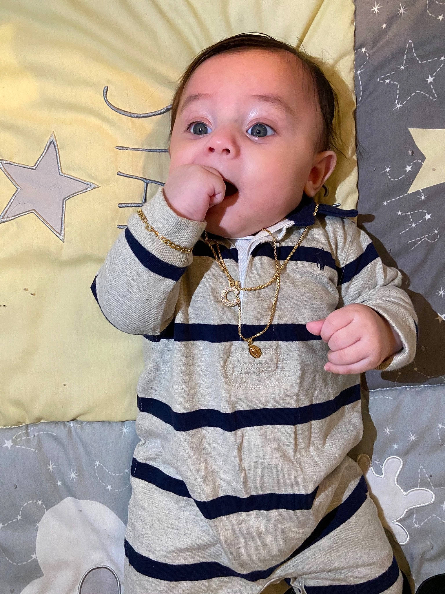 Cash is registered to the contest to win money with this photo: baby, baby_grabbing_for_something, baby_products, baby_toddler_clothing, cheek, child, eating, eye, human, human_body, overall, person, sleeve, star, surprise, sweater, taste, thumb, toddler, tongue